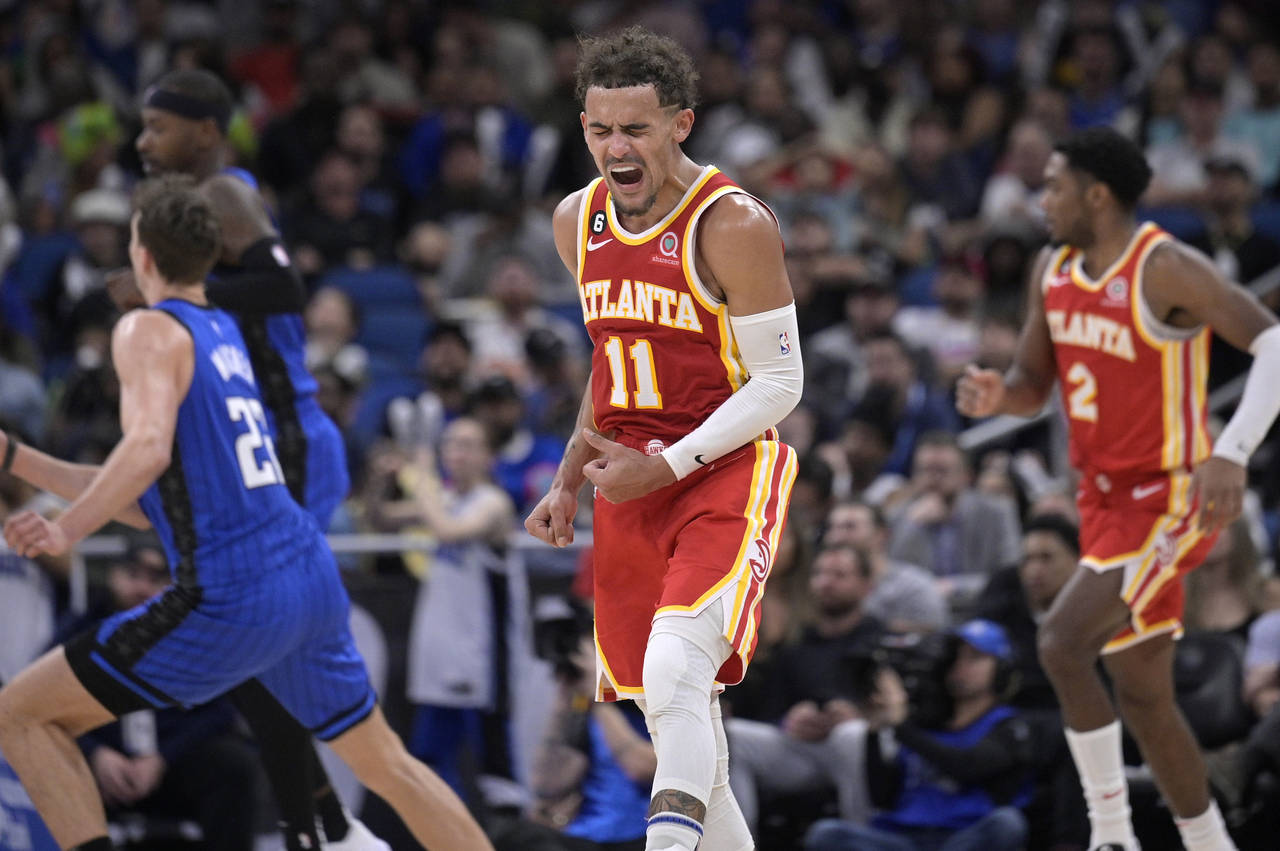 Atlanta Hawks guard Trae Young (11) reacts after a score during the second half of the team's NBA b...