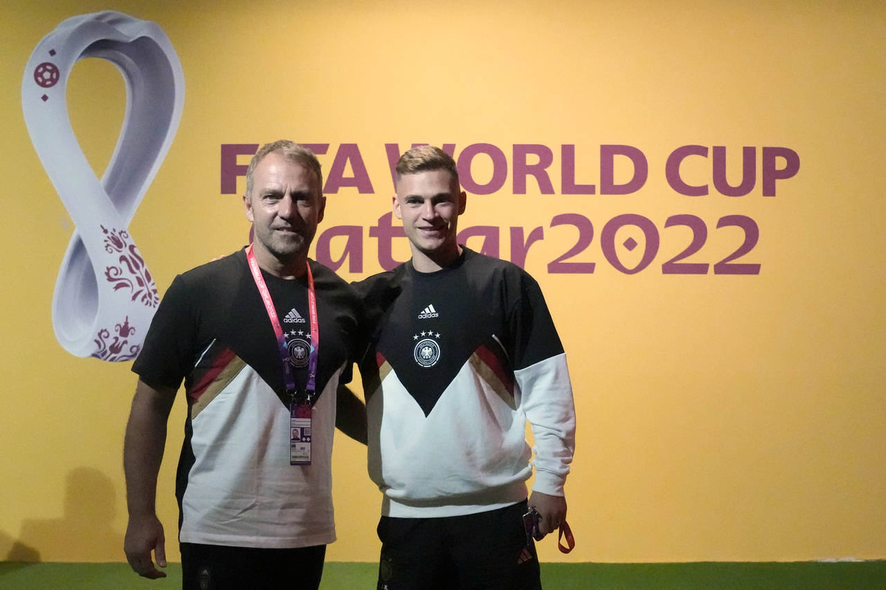 Germany's head coach Hansi Flick, left, and player Joshua Kimmich arrive for a news conference on t...