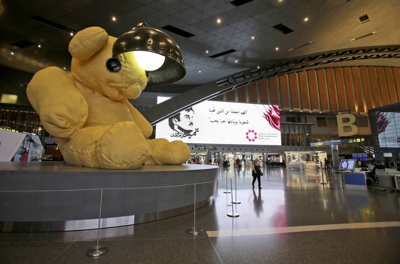 FILE - A giant teddy bear adorns the Hamad International Airport in Doha, Qatar, May 6, 2018. Just ...