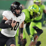 No. 25 UCF beats rival USF 46-39 to reach AAC title game