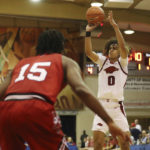 Black's 26 points carry No. 9 Arkansas past Louisville 80-54