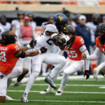 Anderson's 2 long TD runs help W. Virginia top Oklahoma St.