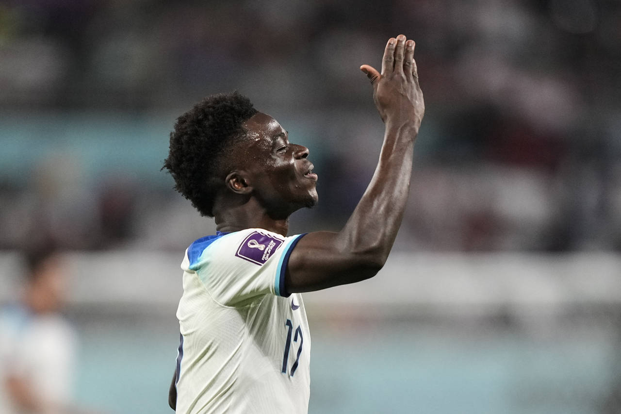 England's Bukayo Saka celebrates after scoring his side's fourth goal against Iran during the World...