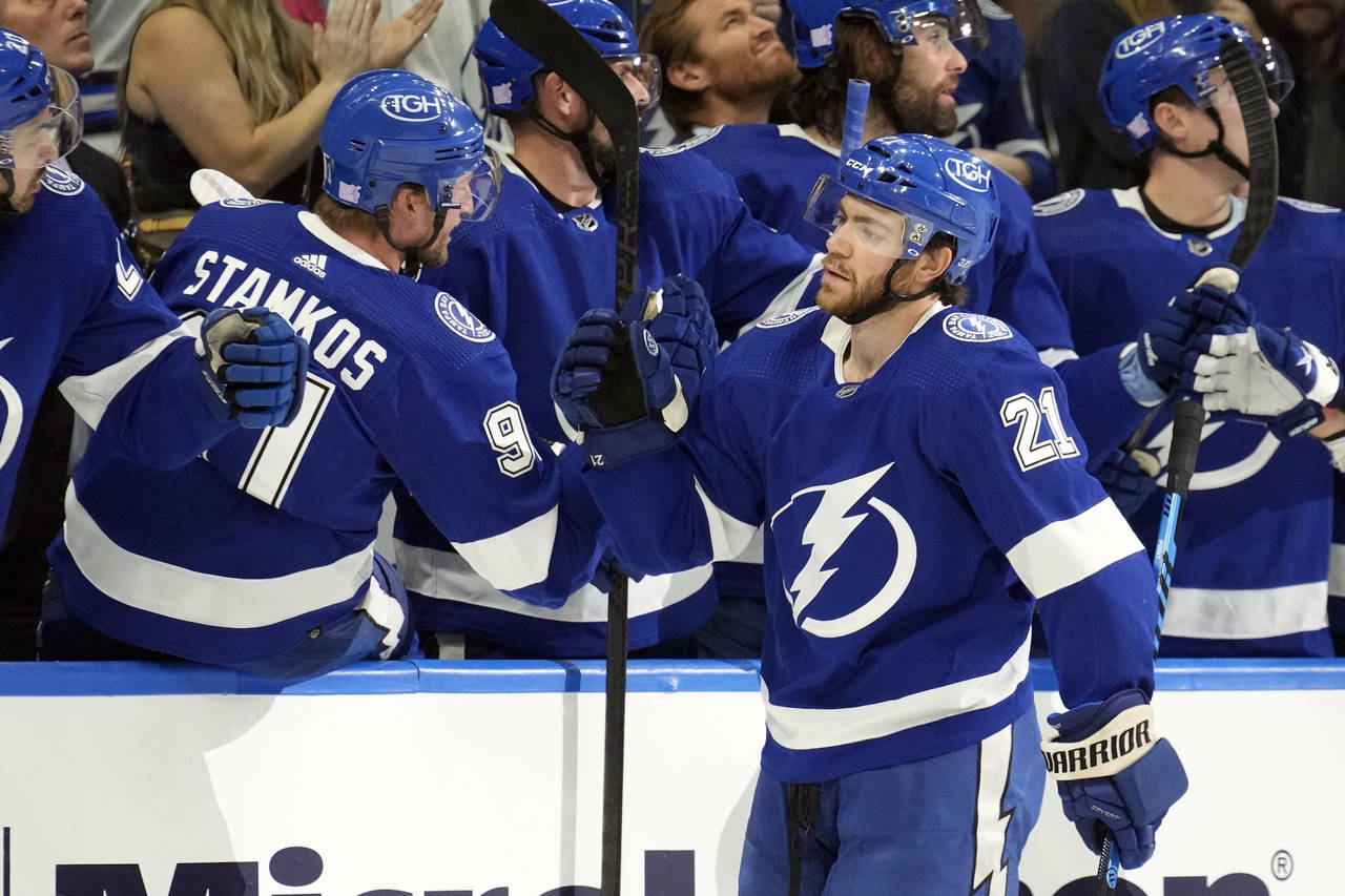 Tampa Bay Lightning center Brayden Point (21) celebrates with the bench after his goal against the ...
