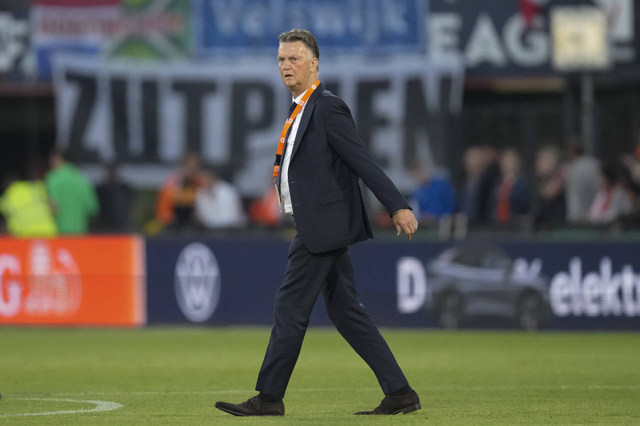 FILE - Netherlands' coach Louis van Gaal crosses the pitch as he heads to the dugout during the UEF...
