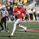 No. 3 Michigan keeps title hopes alive with rout of Ohio St