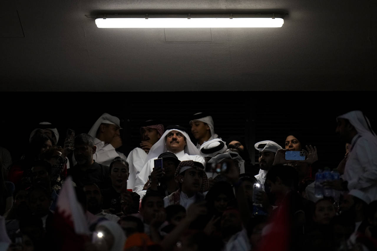 Fans watch a World Cup group A soccer match between the Netherlands and Qatar at the Al Bayt Stadiu...
