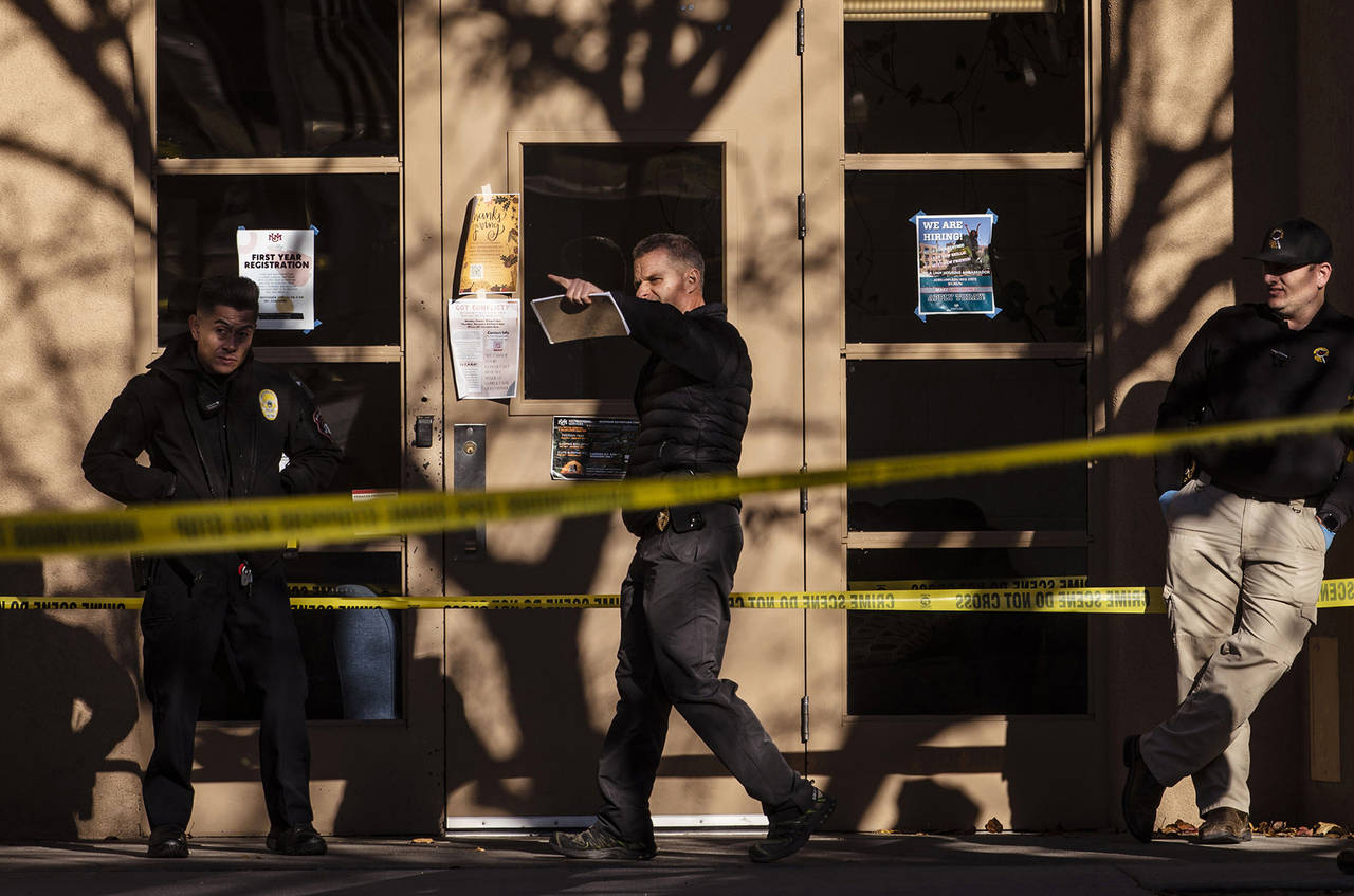 Law enforcement continue their investigation of a deadly overnight shooting at Coronado Hall on the...