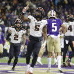 
              Oregon State running back Deshaun Fenwick (5) celebrates after scoring against Washington during the first half of an NCAA college football game Friday, Nov. 4, 2022, in Seattle. (AP Photo/John Froschauer)
            