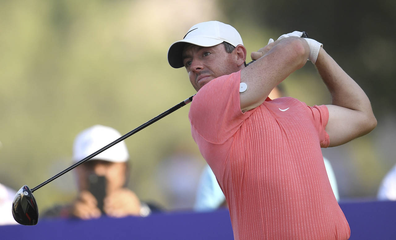 Rory McIlroy of Northern Ireland tees off at the 18th hole during DP World Tour Championship in Dub...