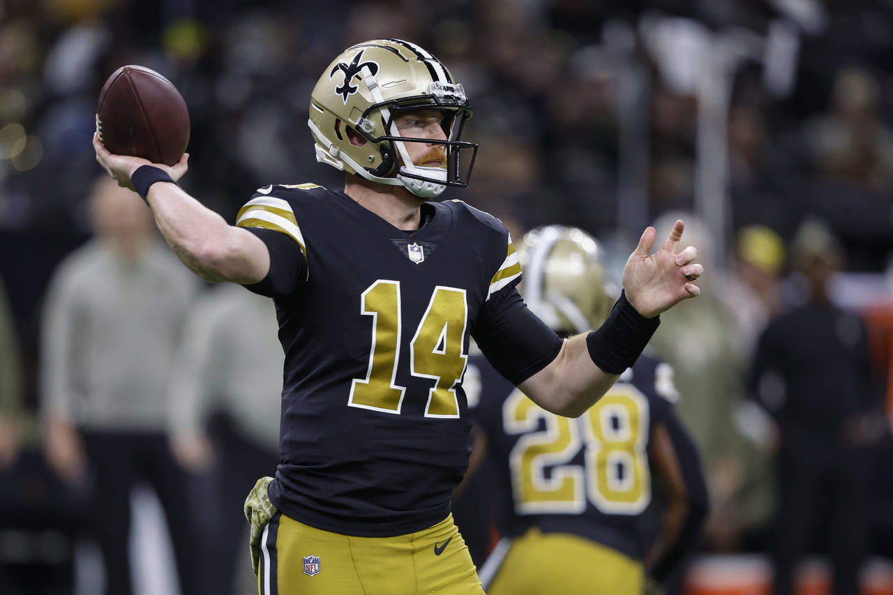 New Orleans Saints quarterback Andy Dalton passes against the Los Angeles Rams in the first half of...
