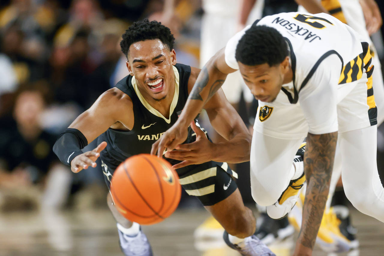 Virginia Commonwealth guard Zeb Jackson (2) steals the ball from Vanderbilt guard Tyrin Lawrence (0...