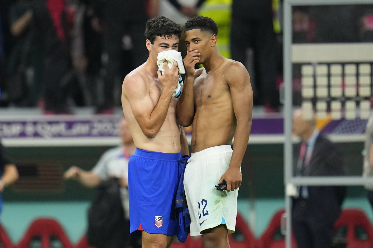 Gio Reyna of the United States, left, talks with England's Jude Bellingham at the end of the World ...