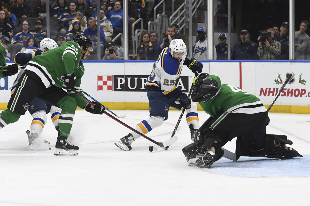 St. Louis Blues' Jordan Kyrou (25) shoots the puck against the Dallas Stars during the second perio...