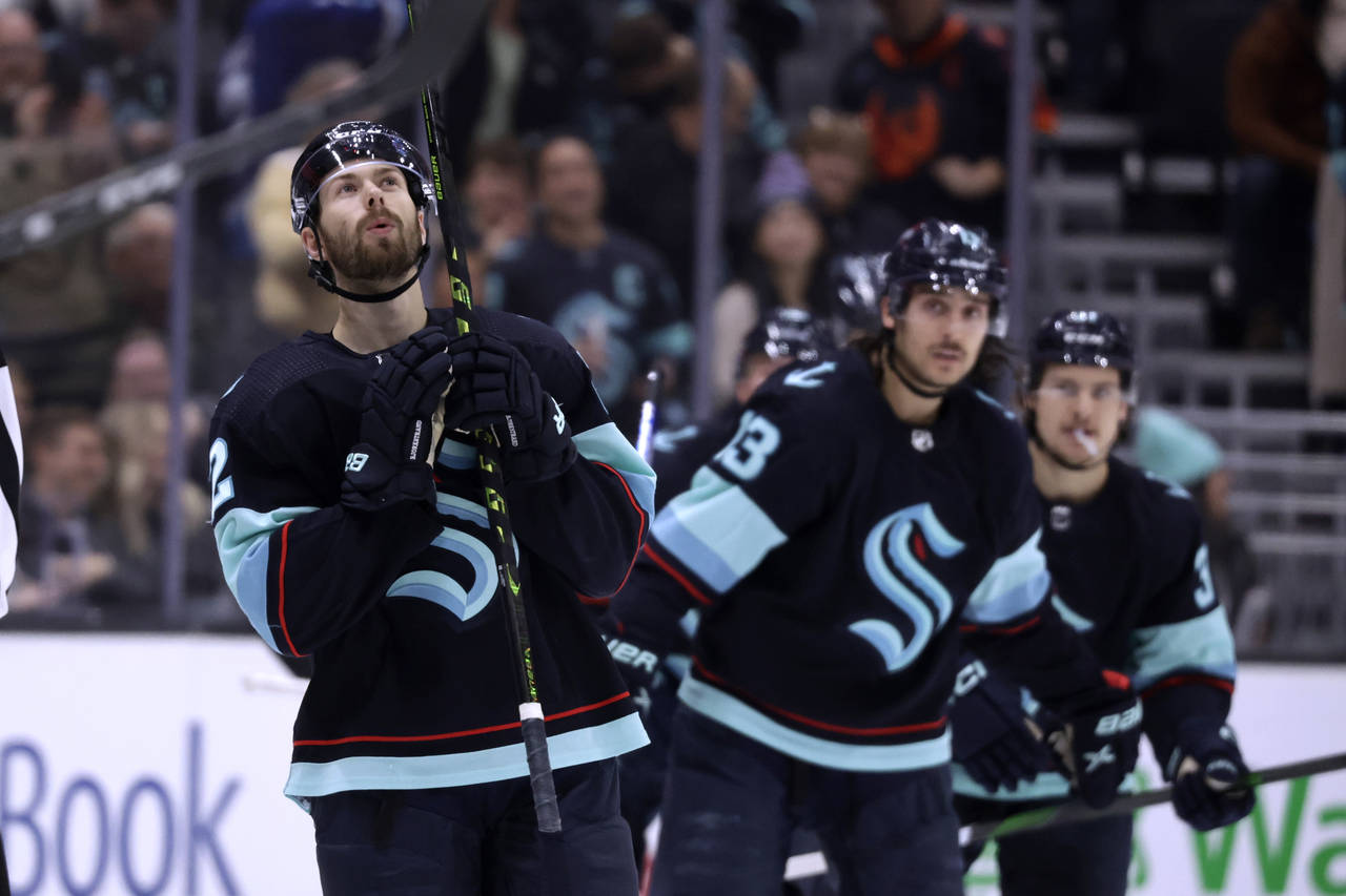 Seattle Kraken right wing Oliver Bjorkstrand (22) looks up as he skates to the bench after scoring ...