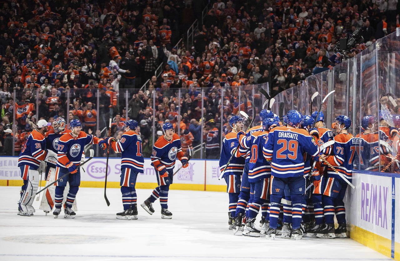 Edmonton Oilers celebrate an overtime win against the Vegas Golden Knights during an NHL hockey gam...