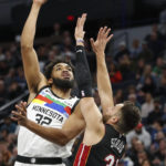 Towns scores 25, Wolves hold on against Heat for 105-101 win