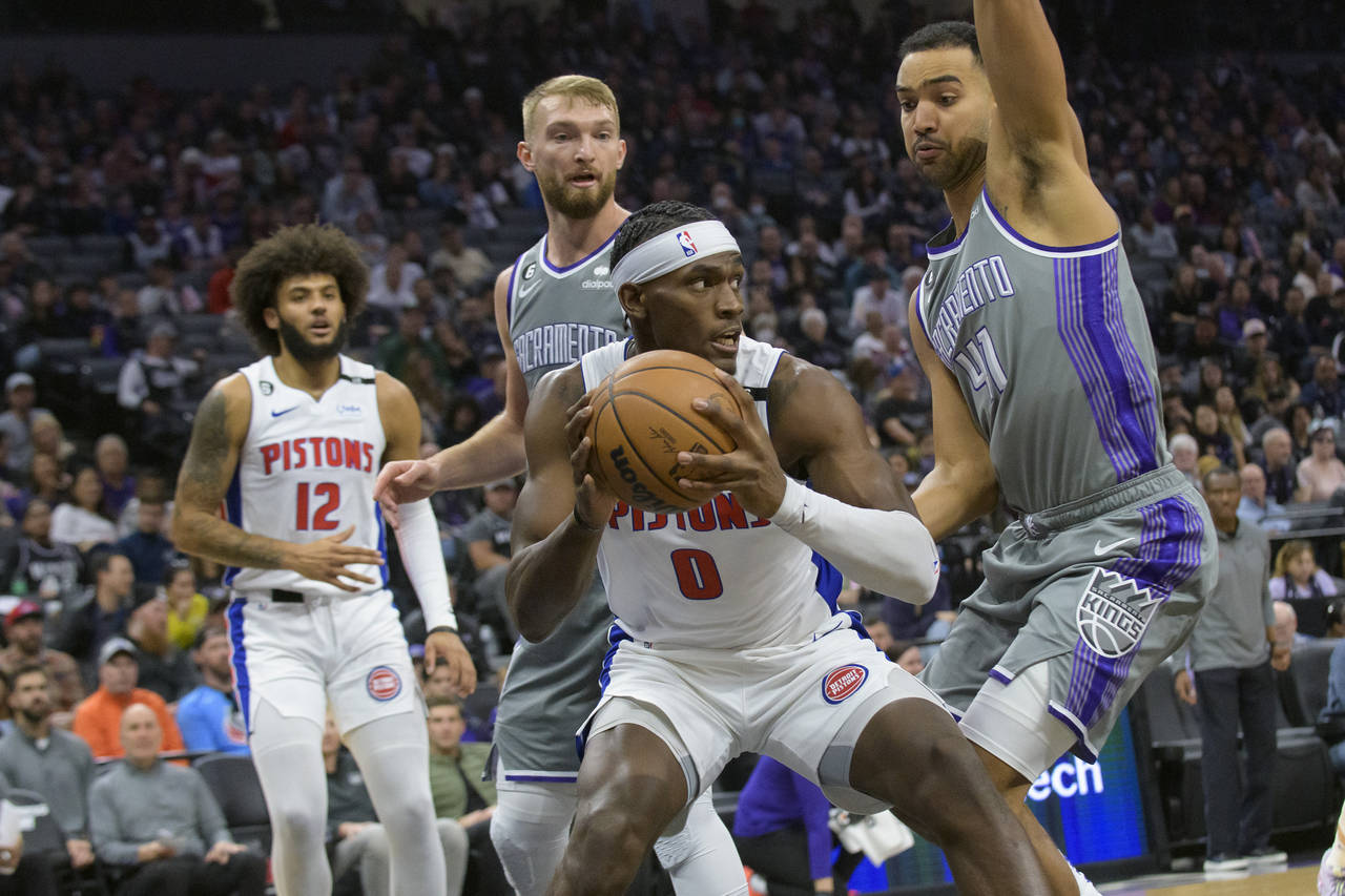 Detroit Pistons center Jalen Duren (0) is guarded by Sacramento Kings forward Trey Lyles (41) durin...