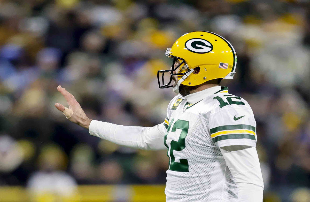 Green Bay Packers quarterback Aaron Rodgers gestures during the team's NFL football game against th...
