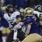 
              Colorado quarterback J.T. Shrout looks for a receiver during the first half of the team's NCAA college football game against Washington, Saturday, Nov. 19, 2022, in Seattle. (AP Photo/Stephen Brashear)
            