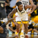 Murray has career night: 31 points, 20 rebounds in Iowa win