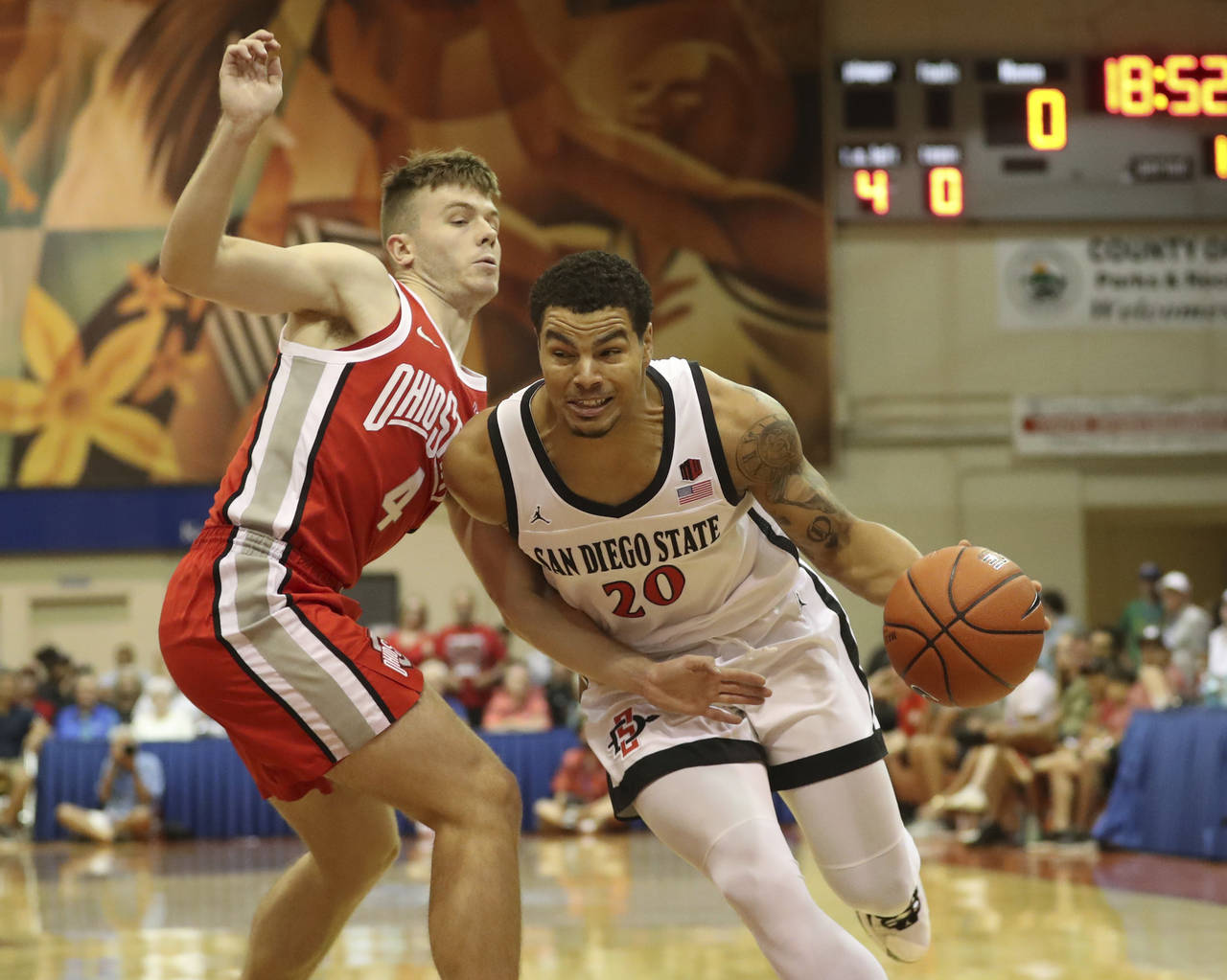 Ohio State guard Sean McNeil (4) guards against San Diego State guard Matt Bradley (20) during the ...