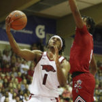 Black's 26 points carry No. 9 Arkansas past Louisville 80-54