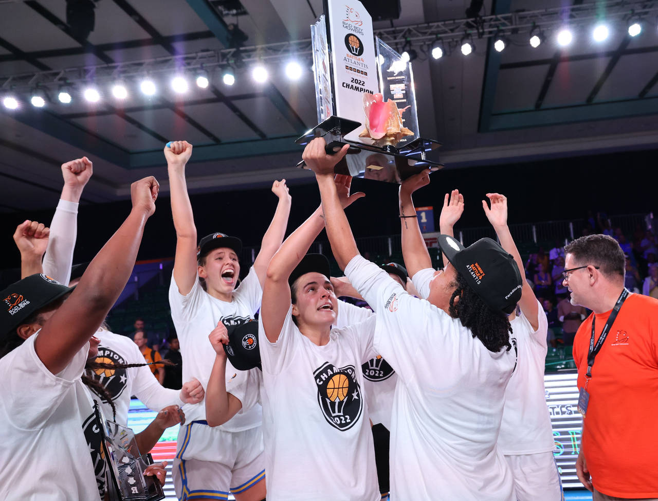 In a photo provided by Bahamas Visual Services, UCLA celebrates after defeating Marquette in the NC...