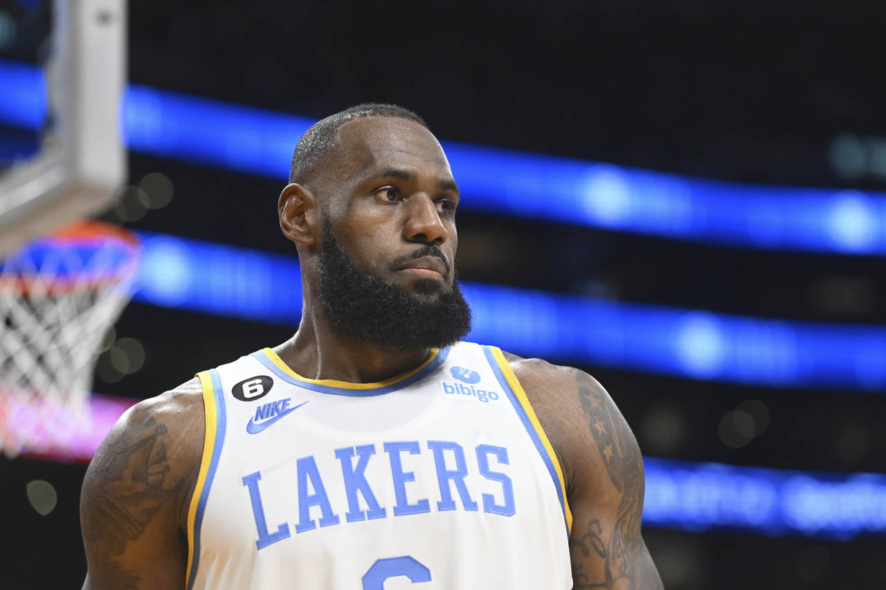 Los Angeles Lakers forward LeBron James looks on during an NBA basketball game against the Denver N...