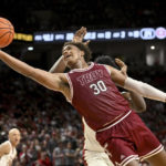 No. 11 Arkansas uses late run to beat Troy, 74-61