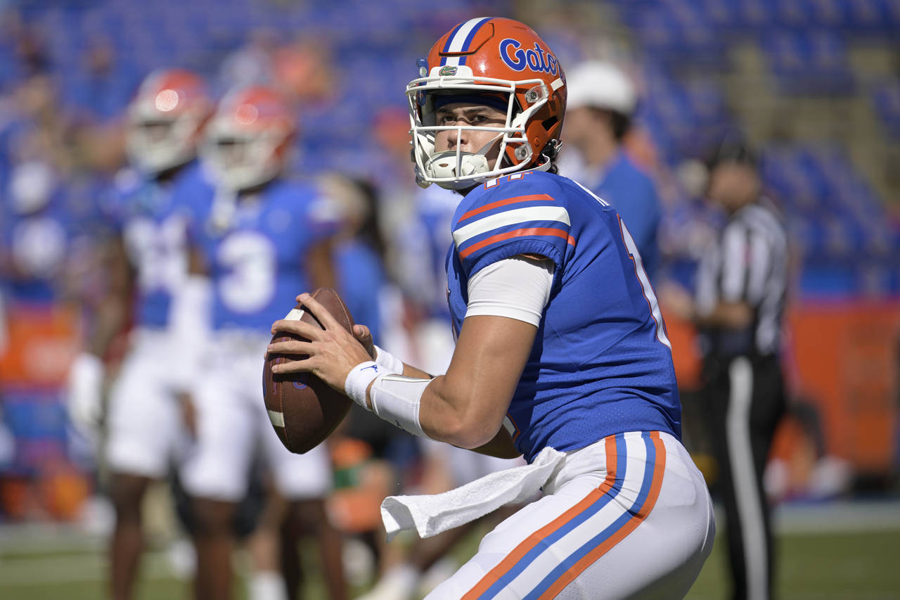 FILE -Florida quarterback Jalen Kitna (11) warms up before an NCAA college football game against Ea...