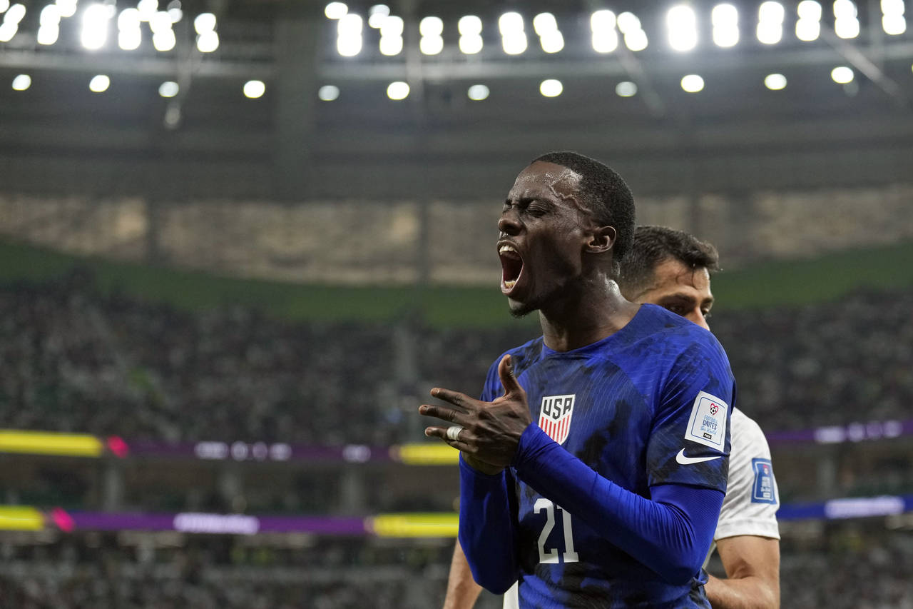 United States' Tim Weah (21) reacts after losing the ball out of bounds during the World Cup group ...