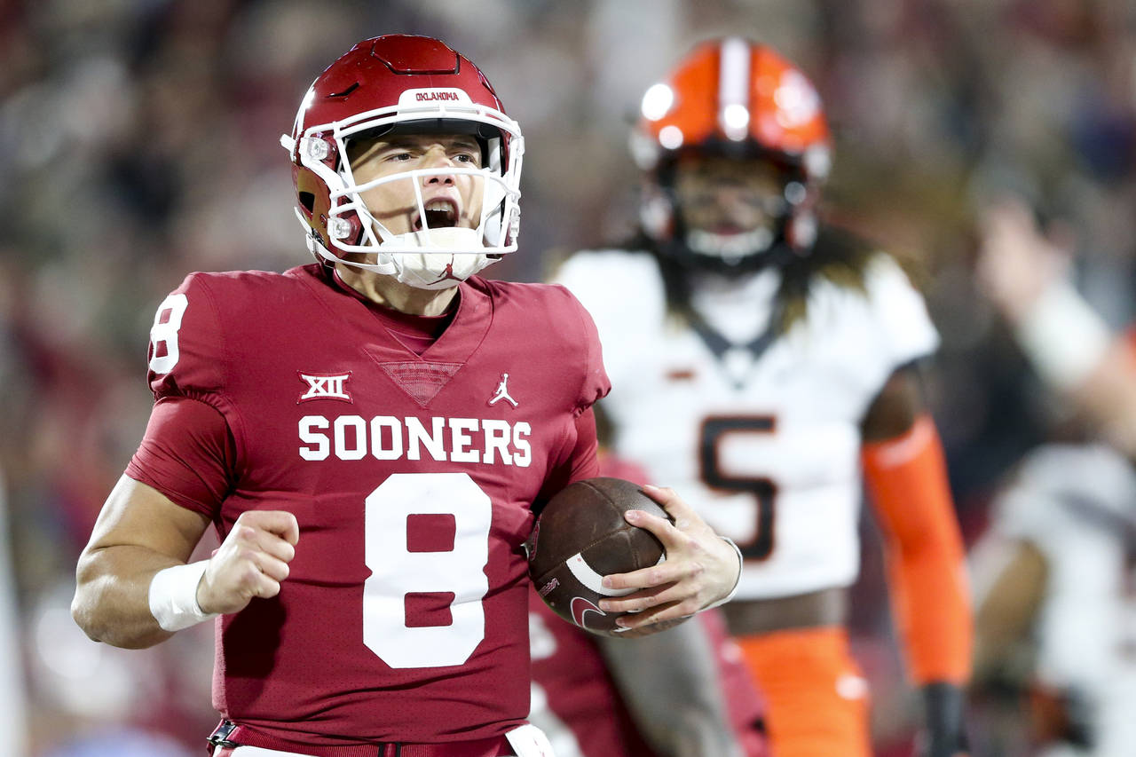 Oklahoma quarterback Dillon Gabriel (8) yells while scoring a touchdown during the first quarter of...