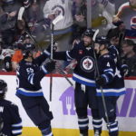 Wheeler nets hat trick, Hellebuyck and Jets blank Avs 5-0