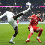 AP PHOTOS: World Cup highlights from Day 2