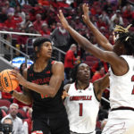 Scott scores 18, No. 22 Maryland blows out Louisville 79-54