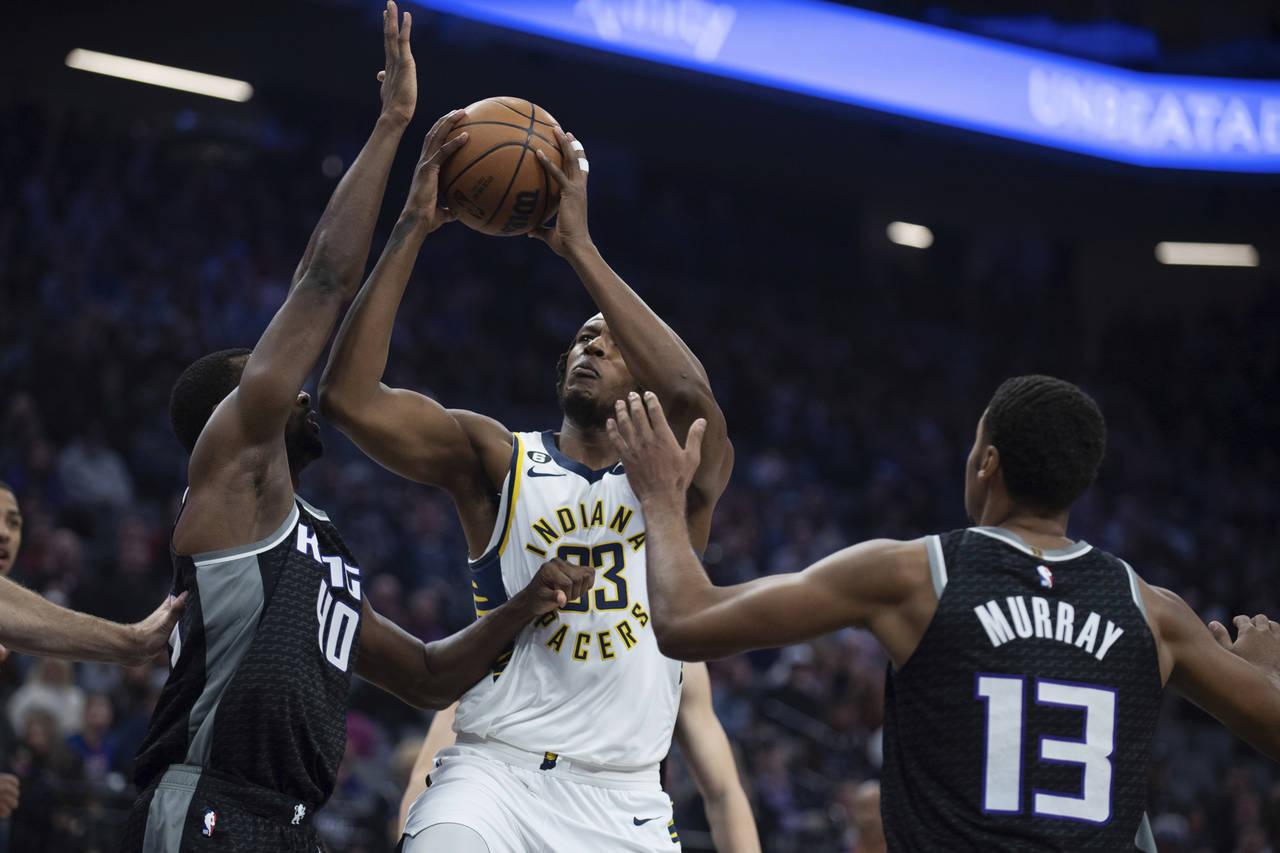Indiana Pacers center Myles Turner (33) shoots between Sacramento Kings forward Harrison Barnes (40...
