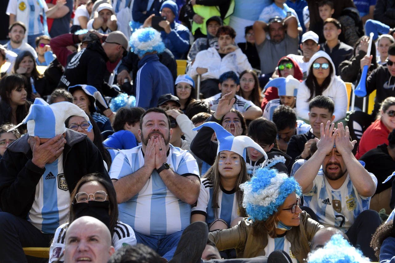 Argentina soccer fans watch their team lose to Saudi Arabia in a World Cup Group C soccer match pla...