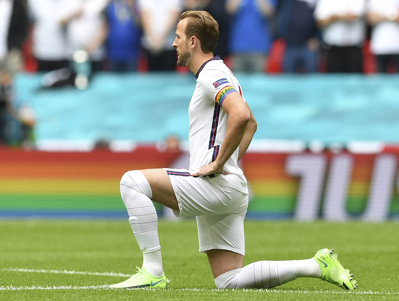 FILE - England's Harry Kane wears a rainbow armband as he takes the knee prior to the Euro 2020 soc...