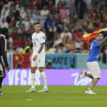 Protestor with rainbow flag runs onto field at World Cup