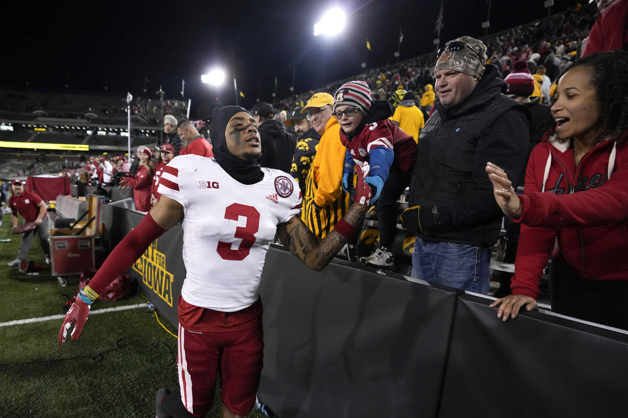 Nebraska wide receiver Trey Palmer (3) celebrates with fans after an NCAA college football game aga...