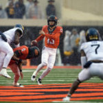 Anderson's 2 long TD runs help W. Virginia top Oklahoma St.