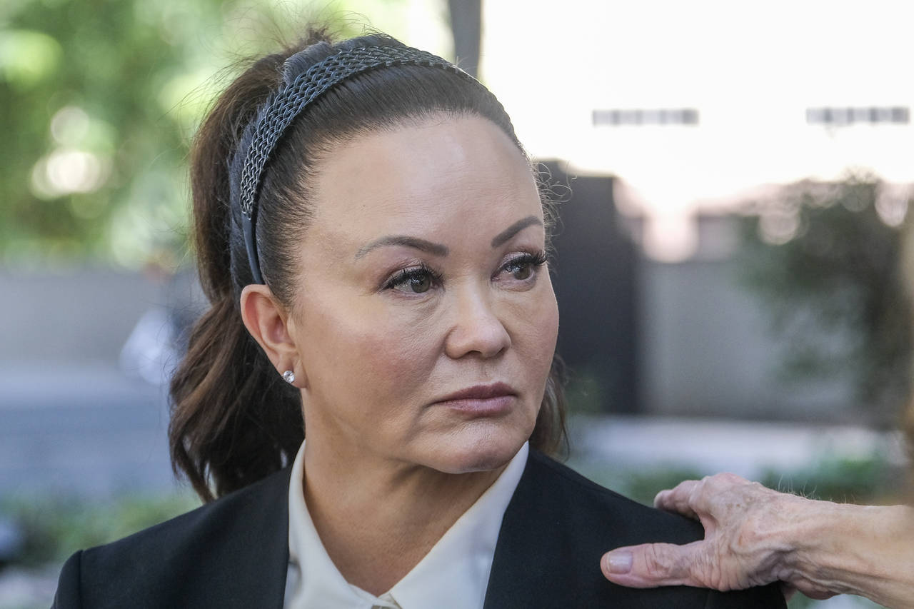 FILE - Alana Gee, the widow of a former University of Southern California football player suing the...