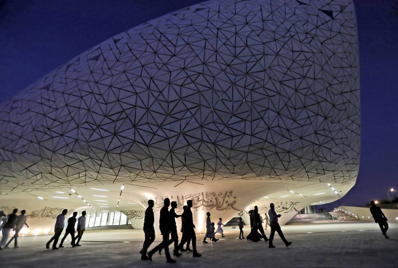 FILE - People leave a mosque to have their evening meal, Iftar, during the holy month of Ramadan, a...