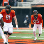 Anderson's 2 long TD runs help W. Virginia top Oklahoma St.