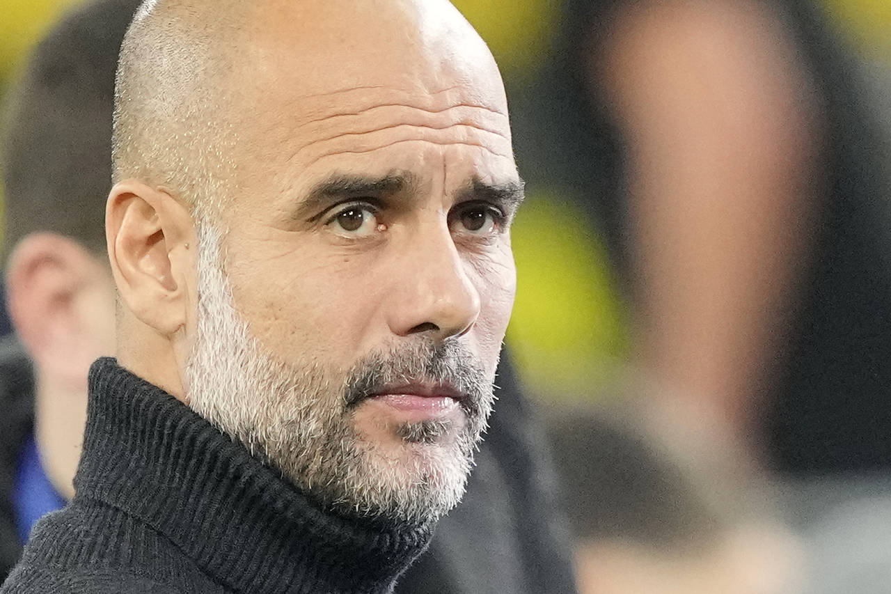 Manchester City's head coach Pep Guardiola gestures prior to the Champions League Group G soccer ma...