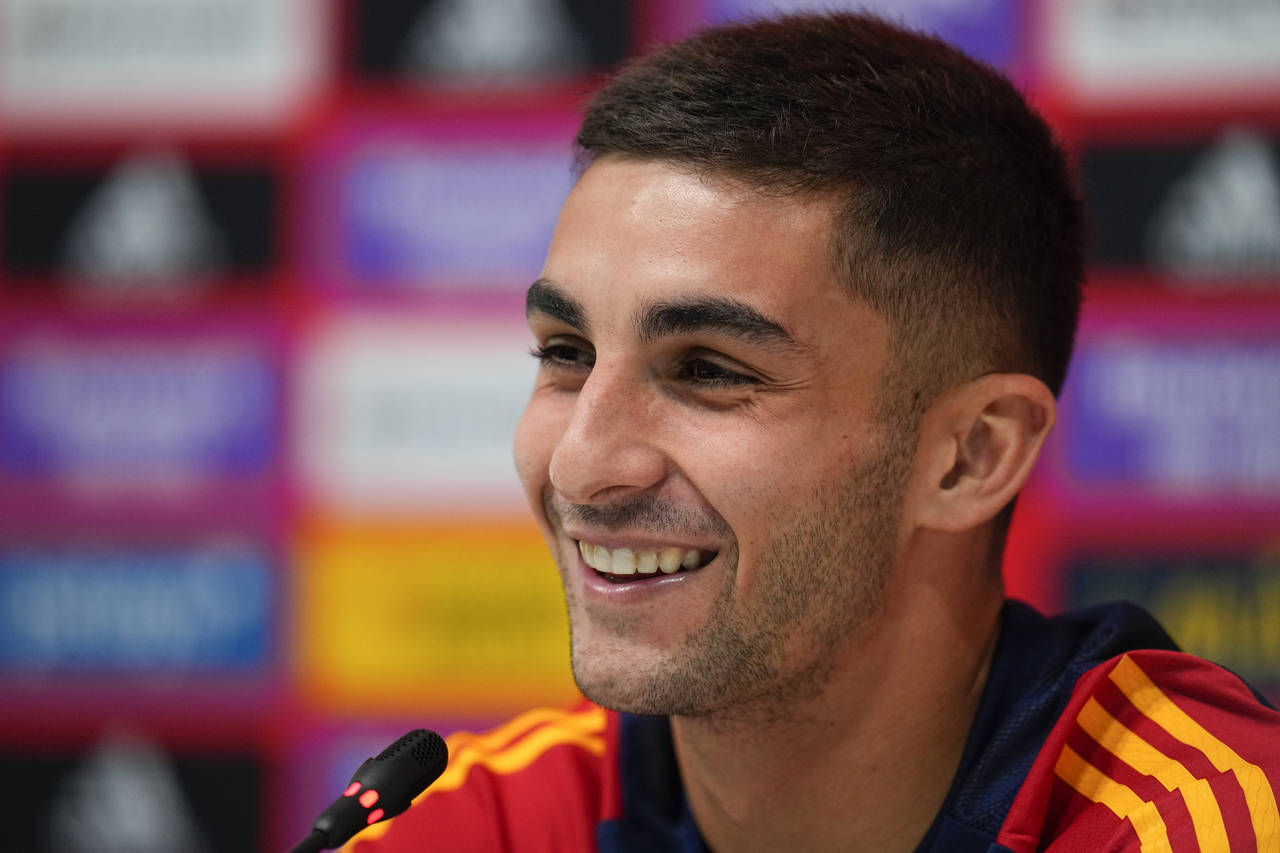 Spain's Ferran Torres speaks to reporters during a news conference at Qatar University in Doha, Sun...