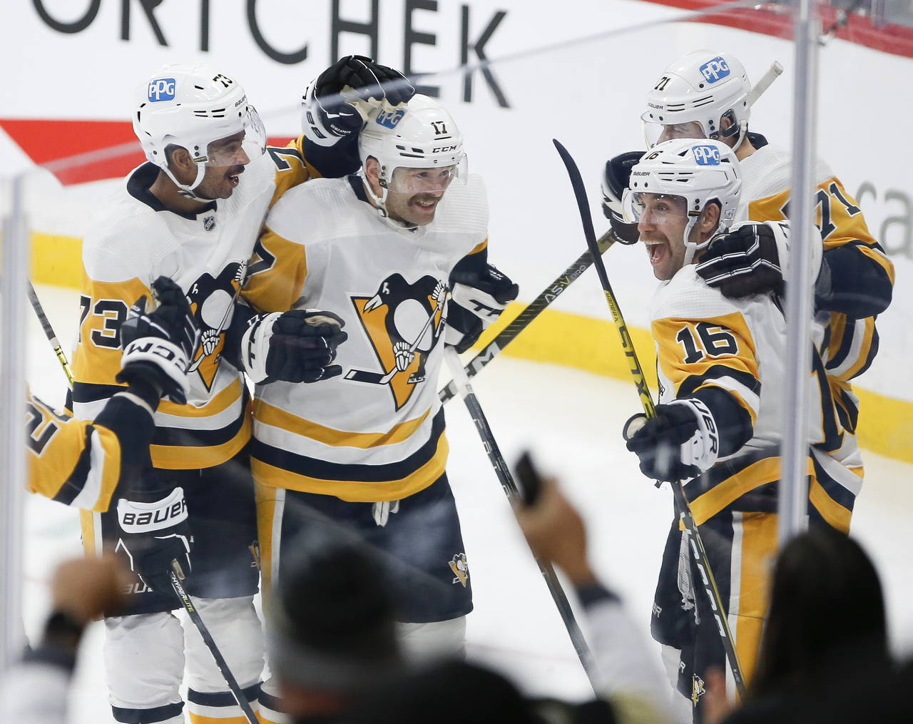 Pittsburgh Penguins' Pierre-Olivier Joseph (73), Bryan Rust (17), Evgeni Malkin (71) and Jason Zuck...