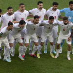 Iran government supporters confront protesters at World Cup