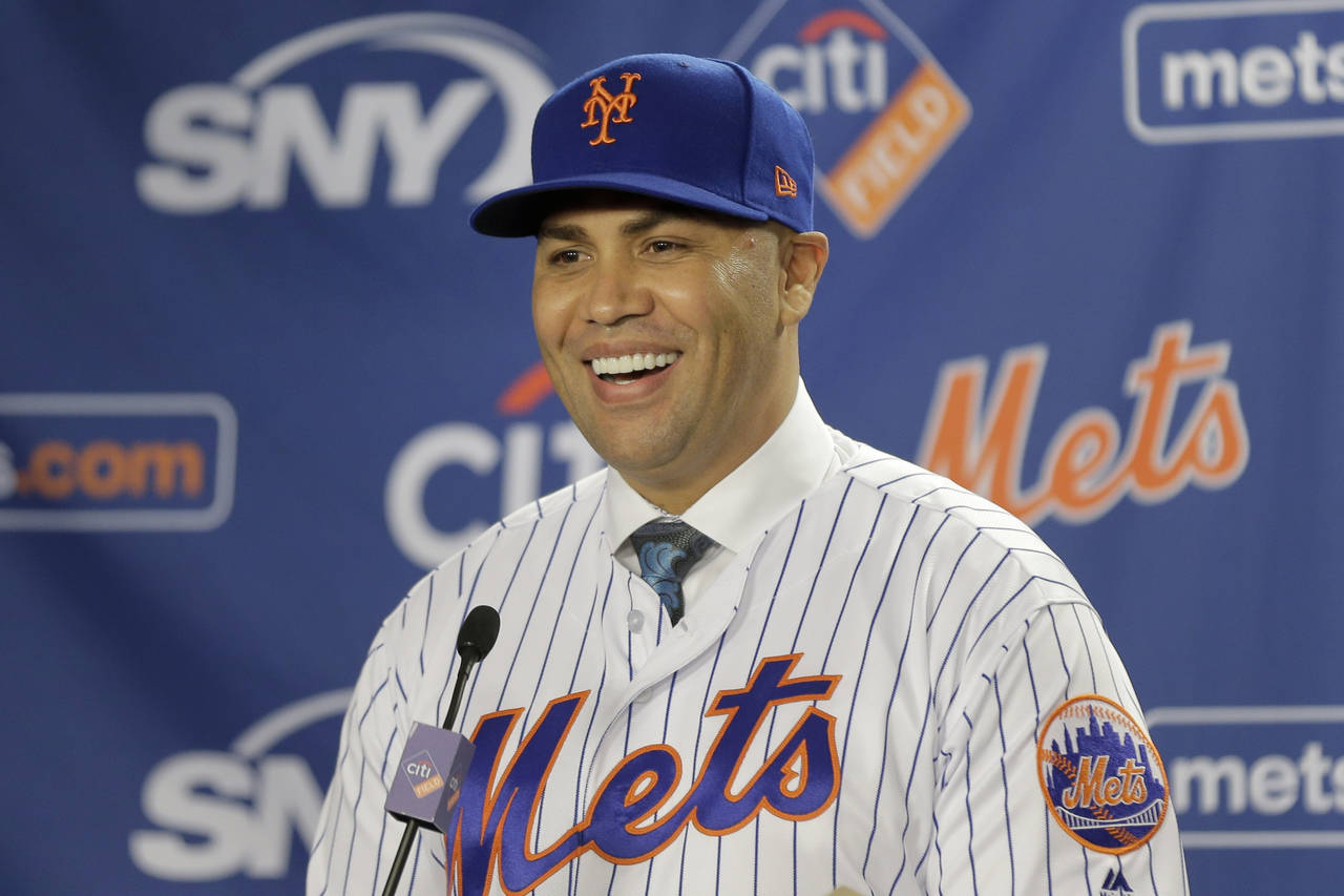 FILE - New York Mets new manager Carlos Beltran smiles during an introductory baseball news confere...